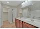 Double vanity bathroom with a large mirror and shower at 7564 Daniel Boone Ct, Las Vegas, NV 89166