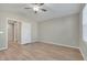 Light-filled bedroom, showcasing wood-look floors and ample space at 7564 Daniel Boone Ct, Las Vegas, NV 89166