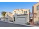 Two-story home with attached garage and front yard at 7564 Daniel Boone Ct, Las Vegas, NV 89166