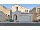 Two-story home with attached garage and front yard at 7564 Daniel Boone Ct, Las Vegas, NV 89166