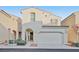 Two story house with a two car garage and landscaped front yard at 7564 Daniel Boone Ct, Las Vegas, NV 89166