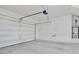 Spacious garage with overhead door and ample storage space at 7564 Daniel Boone Ct, Las Vegas, NV 89166