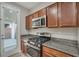 Kitchen features gas range and microwave at 7564 Daniel Boone Ct, Las Vegas, NV 89166