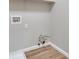 Laundry closet with hookups and shelving at 7564 Daniel Boone Ct, Las Vegas, NV 89166