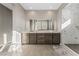 Modern bathroom with a double vanity and a large marble shower at 8990 Rolling Pietra St, Las Vegas, NV 89166