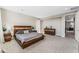 Spacious bedroom with a large bed, dresser, and plenty of natural light at 8990 Rolling Pietra St, Las Vegas, NV 89166