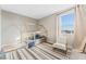 Charming bedroom featuring a toddler bed, chair, and patterned rug at 8990 Rolling Pietra St, Las Vegas, NV 89166