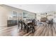 Bright dining area with hardwood floors and a table for six at 8990 Rolling Pietra St, Las Vegas, NV 89166