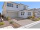 Well maintained two story home with a two car garage and clean landscaping at 8990 Rolling Pietra St, Las Vegas, NV 89166