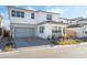 Two-story house with gray garage door and landscaping at 8990 Rolling Pietra St, Las Vegas, NV 89166