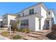 Inviting two-story home featuring modern architecture and low maintenance landscaping at 8990 Rolling Pietra St, Las Vegas, NV 89166