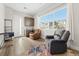 Comfortable living room features a wet bar, ample windows, and natural light at 8990 Rolling Pietra St, Las Vegas, NV 89166