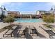 Relaxing poolside featuring lounge chairs and community access at 8990 Rolling Pietra St, Las Vegas, NV 89166