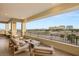 Large balcony offering scenic golf course views at 9121 Las Manaitas Ave # 401, Las Vegas, NV 89144