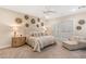 Spacious bedroom with plush bedding and sitting area at 9121 Las Manaitas Ave # 401, Las Vegas, NV 89144