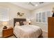 Bright bedroom with window shutters and neutral decor at 9121 Las Manaitas Ave # 401, Las Vegas, NV 89144