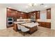 Island kitchen with stainless steel appliances and granite counters at 9121 Las Manaitas Ave # 401, Las Vegas, NV 89144