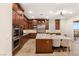 Modern kitchen with double ovens and large island at 9121 Las Manaitas Ave # 401, Las Vegas, NV 89144