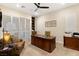 Home office with large desk and built-in shelving at 9121 Las Manaitas Ave # 401, Las Vegas, NV 89144