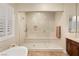 Walk-in shower with built-in seat and glass enclosure at 9121 Las Manaitas Ave # 401, Las Vegas, NV 89144