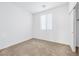 Bright bedroom featuring neutral walls and carpet, plus a window with blinds at 9272 Cantana St, Las Vegas, NV 89123