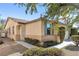 Single story house with tan exterior and gray shutters at 9272 Cantana St, Las Vegas, NV 89123