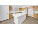 Bright kitchen with island and light wood cabinets at 9272 Cantana St, Las Vegas, NV 89123