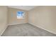 Well-lit bedroom with carpet and window at 10646 Shifting Breeze Ave, Las Vegas, NV 89129