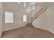 High ceiling living room with staircase and lots of natural light at 10646 Shifting Breeze Ave, Las Vegas, NV 89129