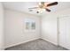 Spacious bedroom with ceiling fan and window shutters at 1066 Elation Ln # 103, Henderson, NV 89002