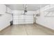 Garage with overhead door and storage shelves at 1066 Elation Ln # 103, Henderson, NV 89002