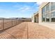 Large backyard with gravel and a metal fence at 10921 Rossa Peak Ave, Las Vegas, NV 89135