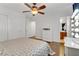 Bedroom with hardwood floors, dresser, and ceiling fan at 1313 Alamosa Ridge Ct, North Las Vegas, NV 89084