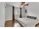 Bedroom with wood floors, ceiling fan and window at 1313 Alamosa Ridge Ct, North Las Vegas, NV 89084