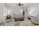 Bright living room with neutral furniture and large windows at 1313 Alamosa Ridge Ct, North Las Vegas, NV 89084