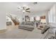 Bright and airy living room with open floor plan and staircase at 1313 Alamosa Ridge Ct, North Las Vegas, NV 89084