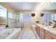 Large bathroom with soaking tub, shower, and double vanity at 256 Garfield Dr, Henderson, NV 89074