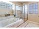 Bathroom features a soaking tub and a separate shower stall at 256 Garfield Dr, Henderson, NV 89074