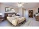 Virtually staged bedroom with a wood bed frame and built-in shelves at 256 Garfield Dr, Henderson, NV 89074