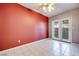 Bedroom with red accent wall and patio access at 256 Garfield Dr, Henderson, NV 89074