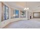Bright dining room with large windows and a chandelier at 256 Garfield Dr, Henderson, NV 89074