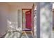 Open red door shows interior entry at 256 Garfield Dr, Henderson, NV 89074