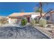 Single-story home with attached garage and landscaping at 256 Garfield Dr, Henderson, NV 89074