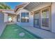 Home's exterior with side yard and double doors at 256 Garfield Dr, Henderson, NV 89074