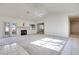 Spacious living room featuring a fireplace and access to a patio at 256 Garfield Dr, Henderson, NV 89074