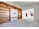 Living room with built-in shelving and view into adjacent room at 256 Garfield Dr, Henderson, NV 89074