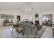 Virtually staged living room with fireplace and large windows at 256 Garfield Dr, Henderson, NV 89074