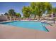 Community swimming pool with lounge chairs at 256 Garfield Dr, Henderson, NV 89074