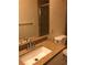 Bathroom featuring a granite countertop and backsplash with a large mirror at 2725 S Nellis Blvd # 1201, Las Vegas, NV 89121