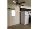 Cozy kitchen with white refrigerator, dark cabinetry, and tile flooring at 2725 S Nellis Blvd # 1201, Las Vegas, NV 89121